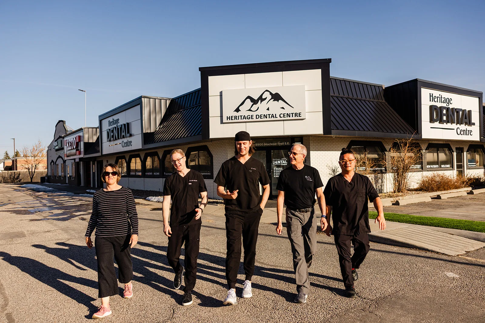 The Heritage Dental Centre team outside the practice at 8900 Macleod Trail SE, Calgary